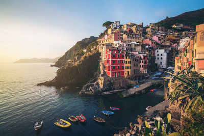 Panoramic view of sea and buildings against sky