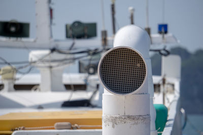 Close-up of coin-operated binoculars against blurred background