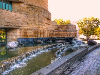 Water fountain in front of building