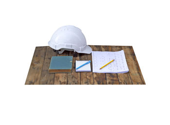 High angle view of broken paper against white background