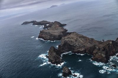 High angle view of rock formation on sea shore