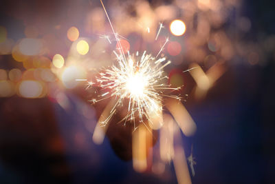 Close-up of firework display at night