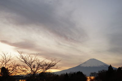Scenic view of silhouette mountains against sky during sunset