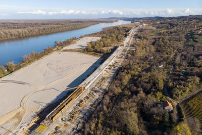 High angle view of river amidst land against sky