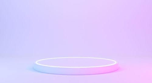 High angle view of pink light against blue background