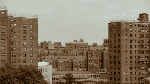 Buildings in city against sky