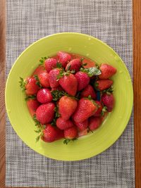 High angle view of strawberries in bowl on table