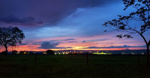 Scenic view of field against sky during sunset