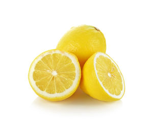 Close-up of oranges against white background