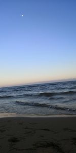 Scenic view of sea against clear sky during sunset