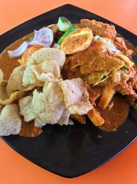 Close-up of served food in plate