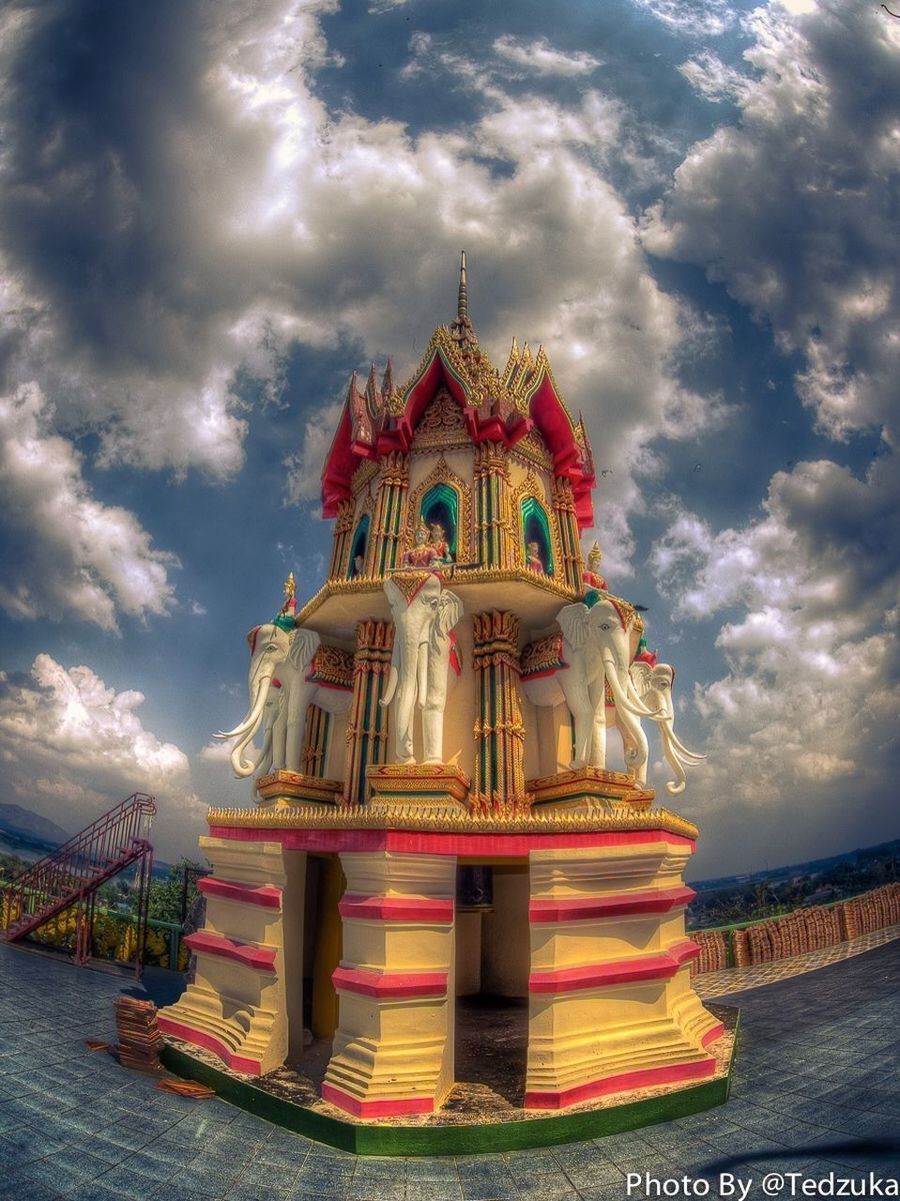 religion, place of worship, spirituality, sky, architecture, cloud - sky, built structure, building exterior, temple - building, low angle view, cloudy, cloud, red, famous place, church, outdoors, travel destinations