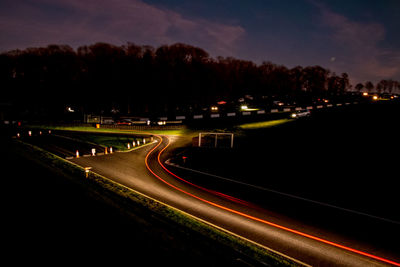 High angle view of light trails on road at night