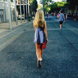 Woman walking on road