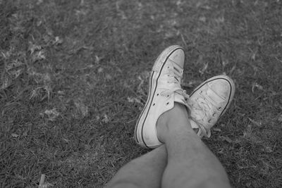 Low section of man wearing canvas shoes