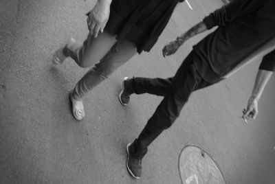 Low section of people on street in city