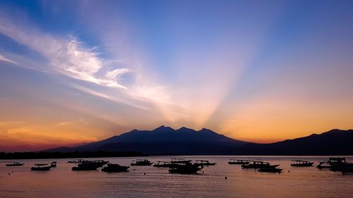 Scenic view of sea against sky at sunset