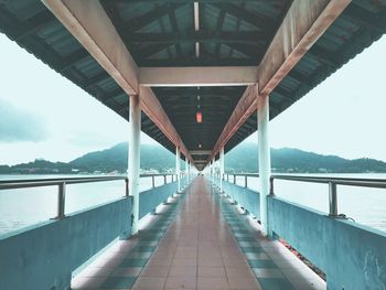 Bridge over river against sky