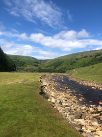 Scenic view of land against sky