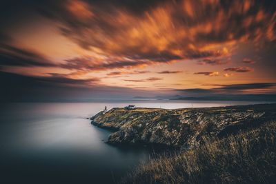 Scenic view of sea against sky at sunset