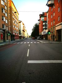 Vehicles on road along buildings