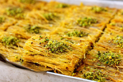 Traditional turkish desserts baklava and lokum in open buffet restaurant at hotel 