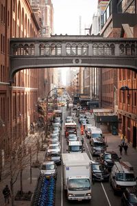 High angle view of cars on street amidst buildings in city