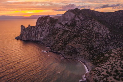 Pink sunset in novyi svit in autumn season. sudak, the republic of crimea. aerial view