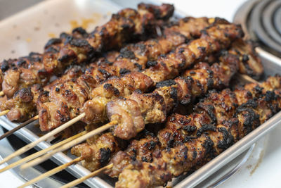High angle view of meat on barbecue grill