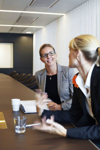 Businesswomen talking in conference room