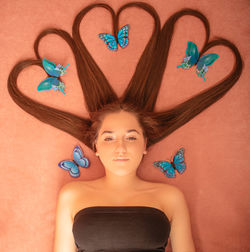 Portrait of young woman making heart shape