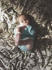 Cute baby boy on bed