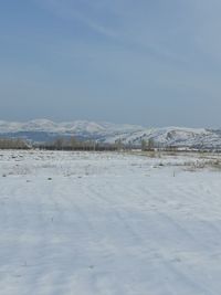 Scenic view of snowcapped mountains against sky