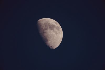 Low angle view of moon against sky at night