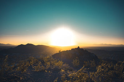 Scenic view of mountains against sky during sunset
