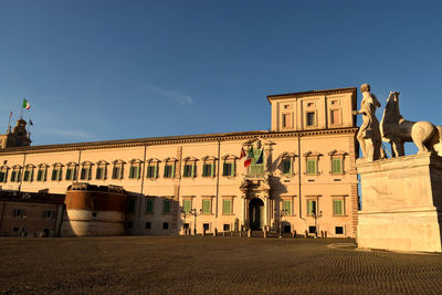 Statue of historic building against sky