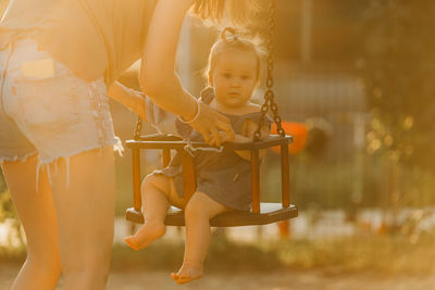 Full length of boy playing in playground