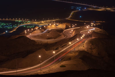 High angle view of light trails on road at night