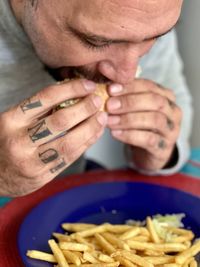 Close-up of man eating food