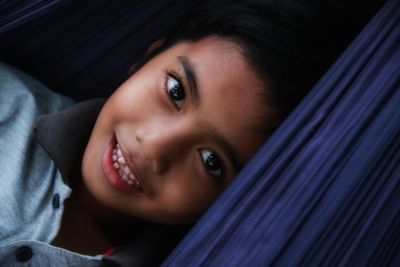 Portrait of a smiling boy lying down