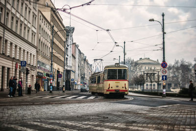 Tram moving on street in city