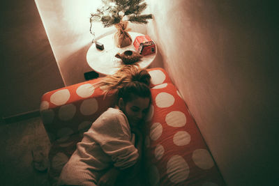 High angle view of woman relaxing at home