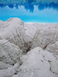 Scenic view of land against blue sky