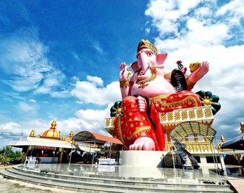 Low angle view of statue against sky