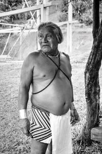 Senior man standing on field