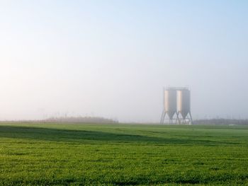 Agricultural field against clear sky