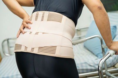 Midsection of woman standing in gym