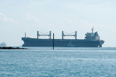 View of ship in sea against sky