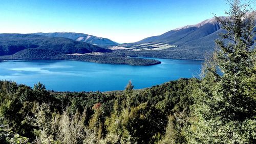 Scenic view of lake with mountains in background