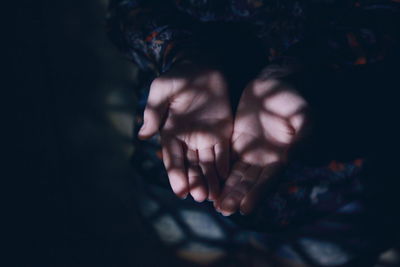Close up of hands praying
